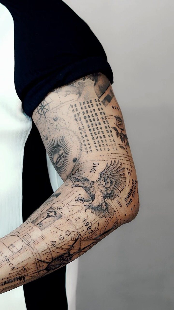 Man's arm with a detailed fine line black ink tattoo sleeve featuring an eagle.