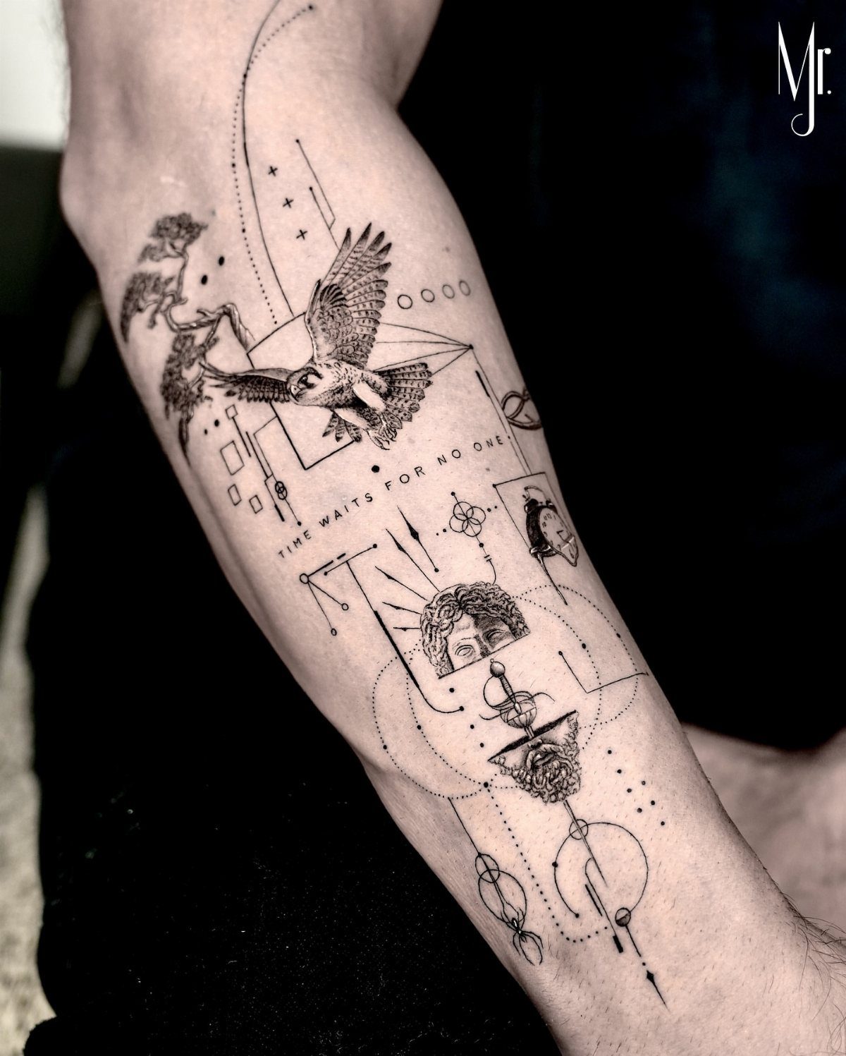 Fine line tattoo on a forearm featuring a bird, face, and geometric elements.
