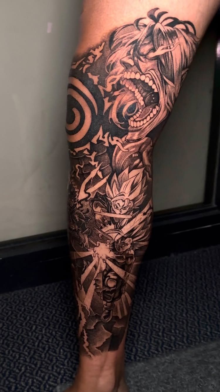 Anime character leg sleeve tattoo in black and grey ink on a person's leg