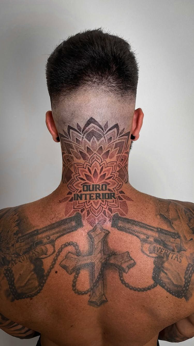 Mandala tattoo with dotwork shading on the back of a man's neck.