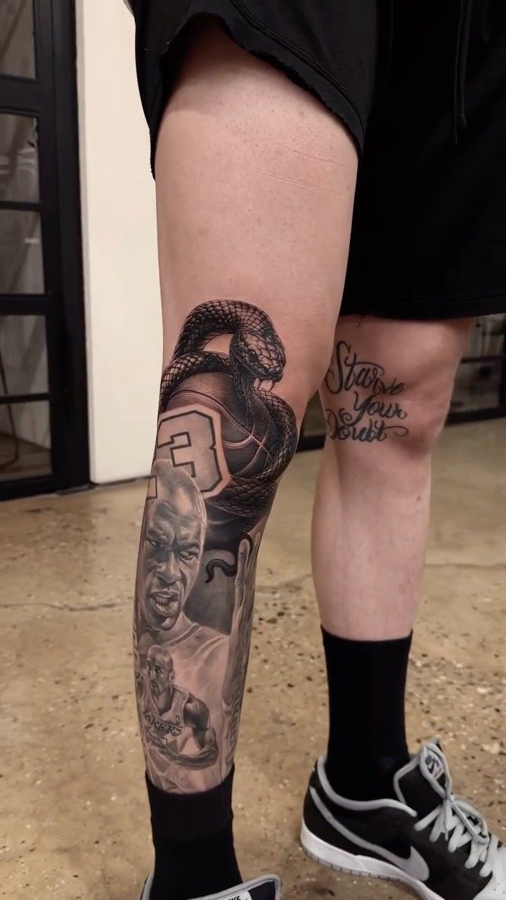 Man's leg with a detailed basketball themed tattoo featuring Michael Jordan and a snake