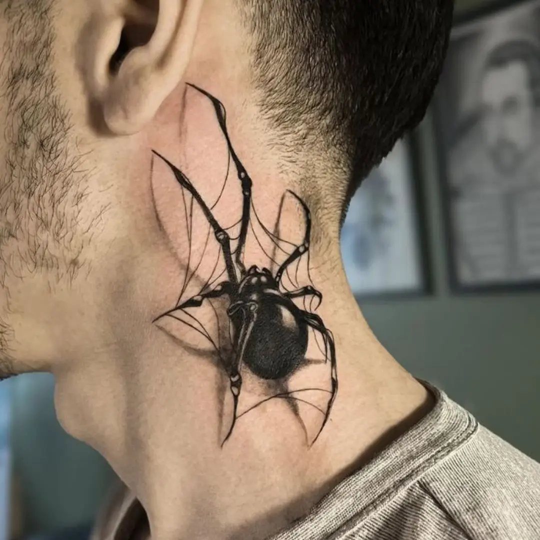 Black and grey spider tattoo with a web on a man's neck
