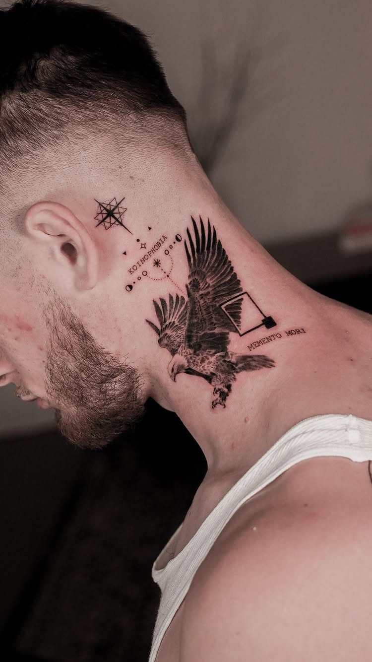Eagle tattoo on a man's neck with geometric elements and small text.