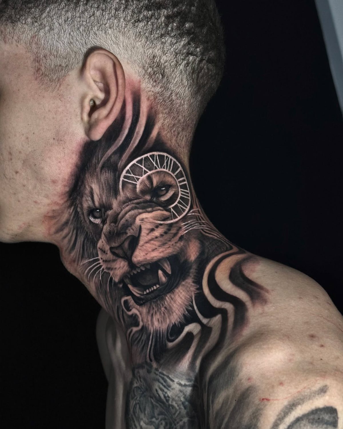 Roaring lion head tattoo with a Roman numeral clock on a man's neck.