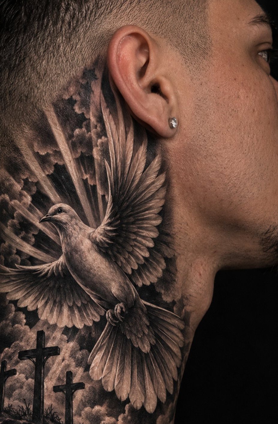 Dove tattoo on a man's neck with rays of light and crosses.