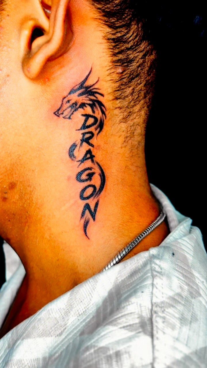Dragon head and the word DRAGON tattooed on the side of a man's neck.