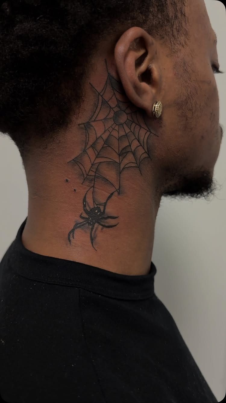 Spider and spider web tattoo on the side of a person's neck