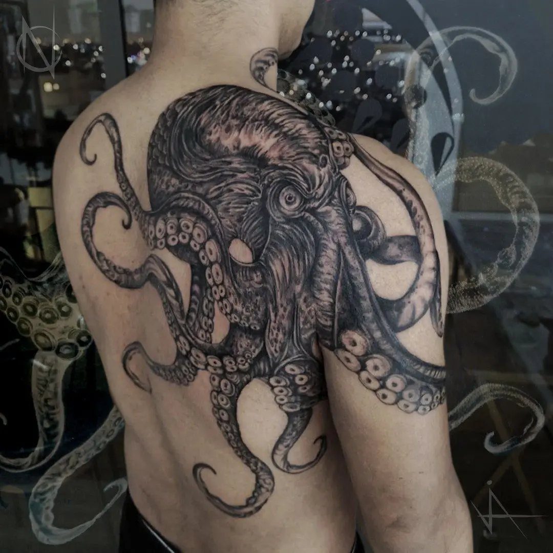 Octopus tattoo with detailed tentacles covering a person's shoulder and upper back.