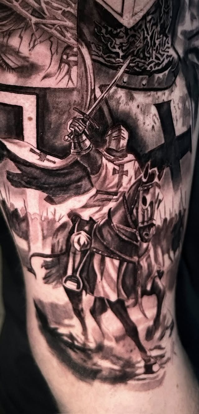 Medieval knight on horseback tattoo in black and grey ink on a forearm.