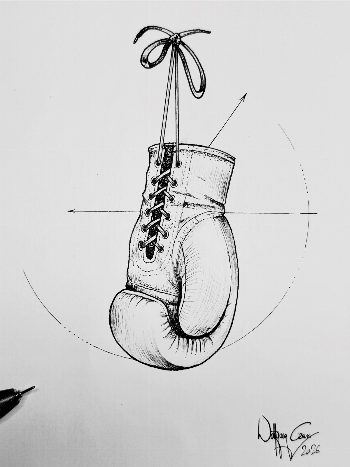 Boxing glove ink sketch with construction lines on white paper.