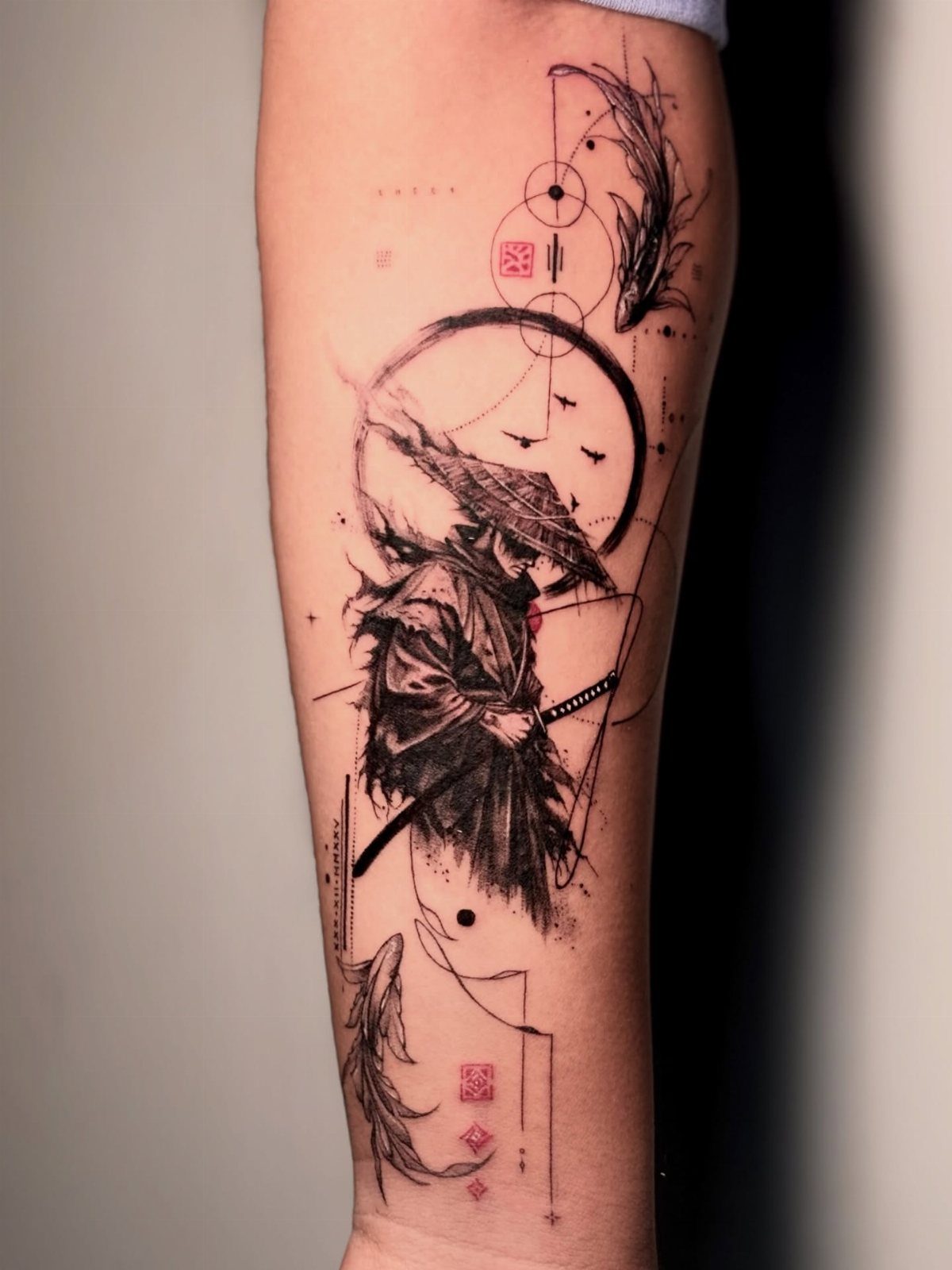 Samurai warrior tattoo on a forearm with geometric elements and koi fish.